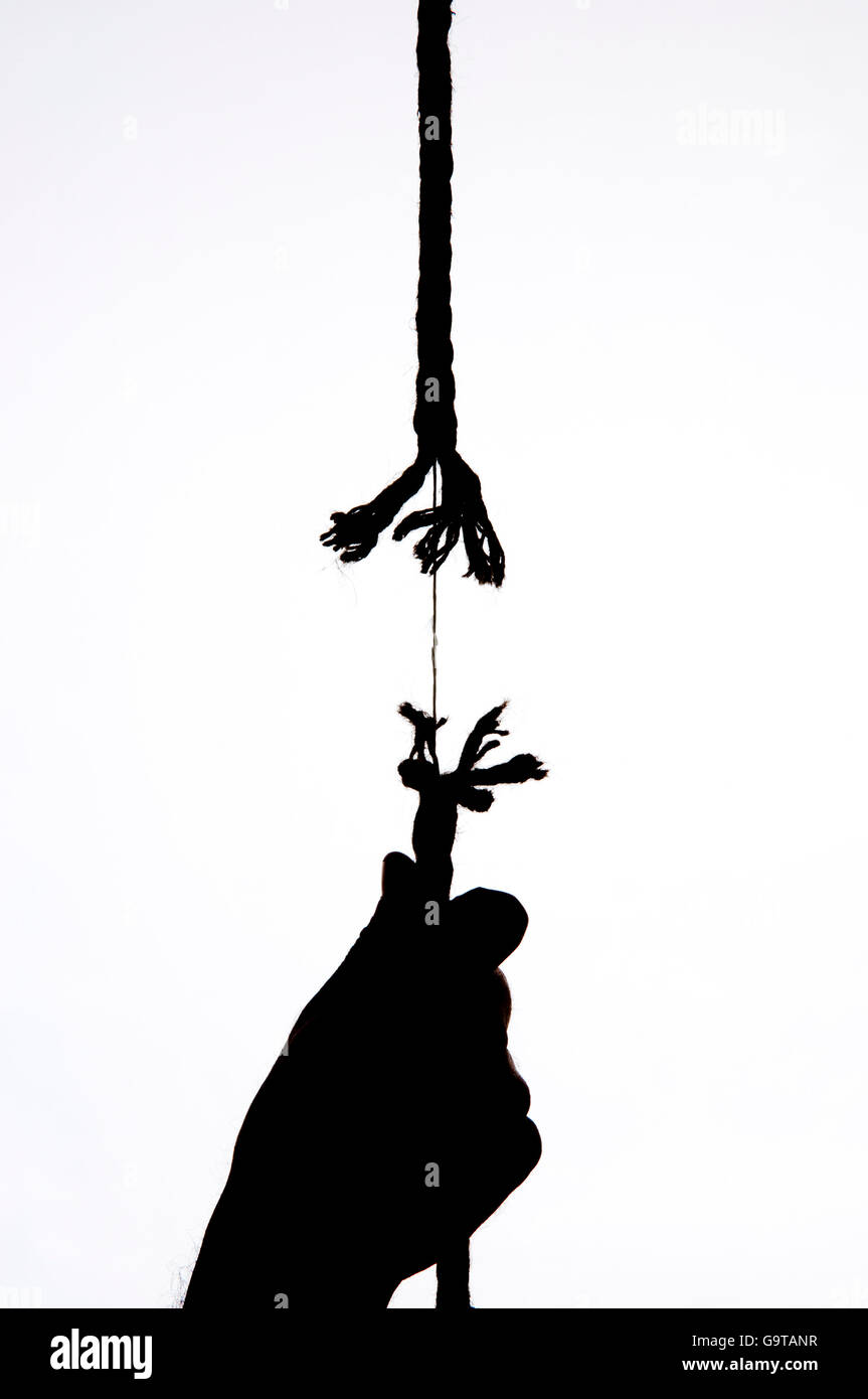 Hanging by a thread - almost broken rope, frayed tensioned cord held  together by a thin string - illustration on white background Stock Photo -  Alamy