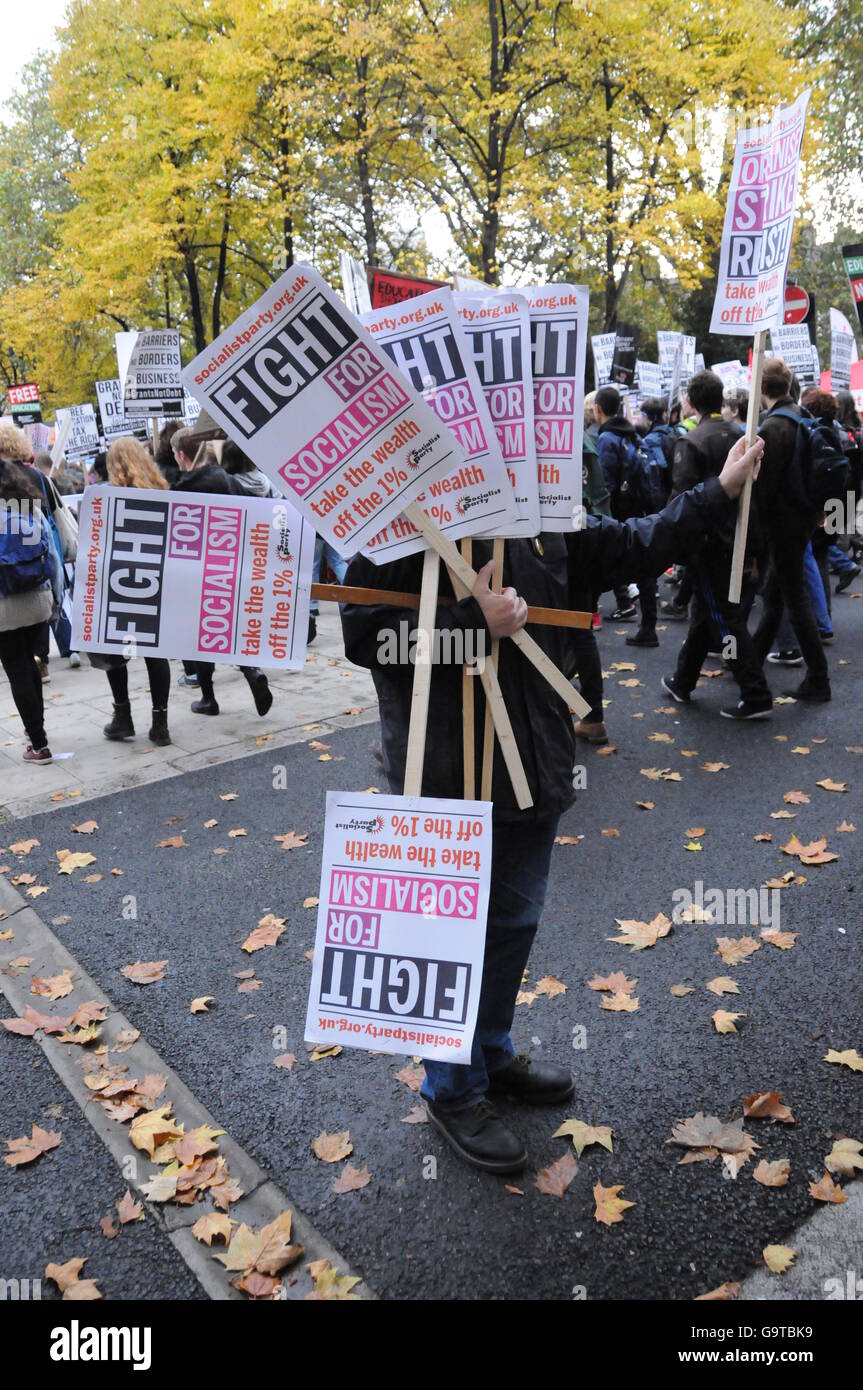 A student activist hands out placards, at the start of the protest ...