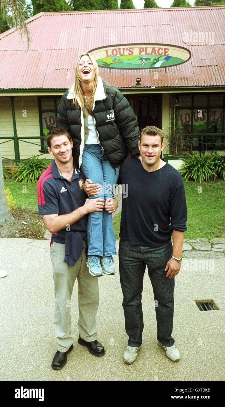 International Rugby Union - British Lions Tour of Australia - Neighbours Soap Visit. British Lions Scott Murray and Jeremy Davidson hold up 'Neigbours' star Holly Valance on the set of the Australian Soap in Melbourne. Stock Photo