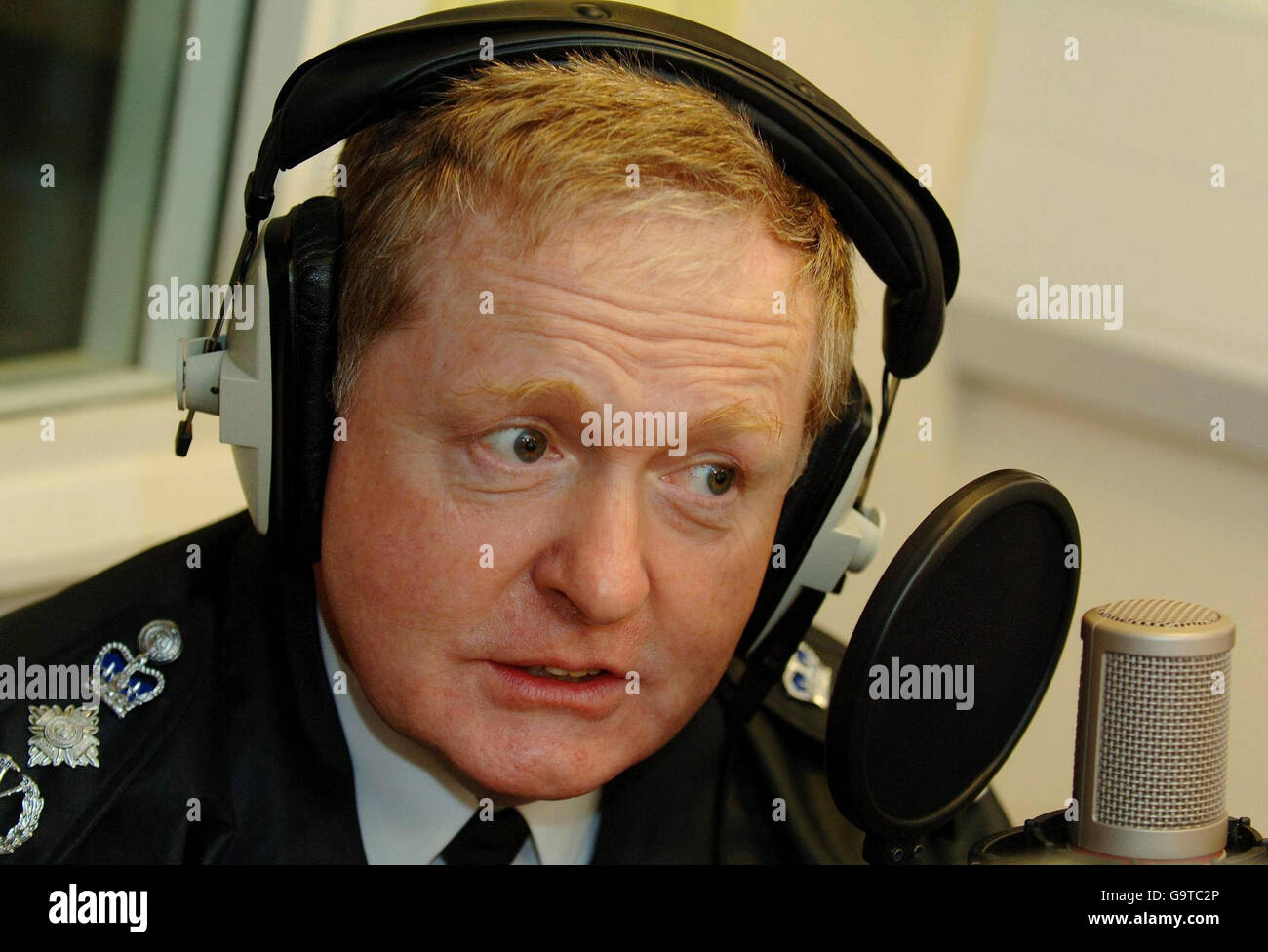Metropolitan Police Commissioner Sir Ian Blair during an interview on the Life radio station at the Hillside Community Centre on the newly regenerated Stonebridge Park Estate. Stock Photo