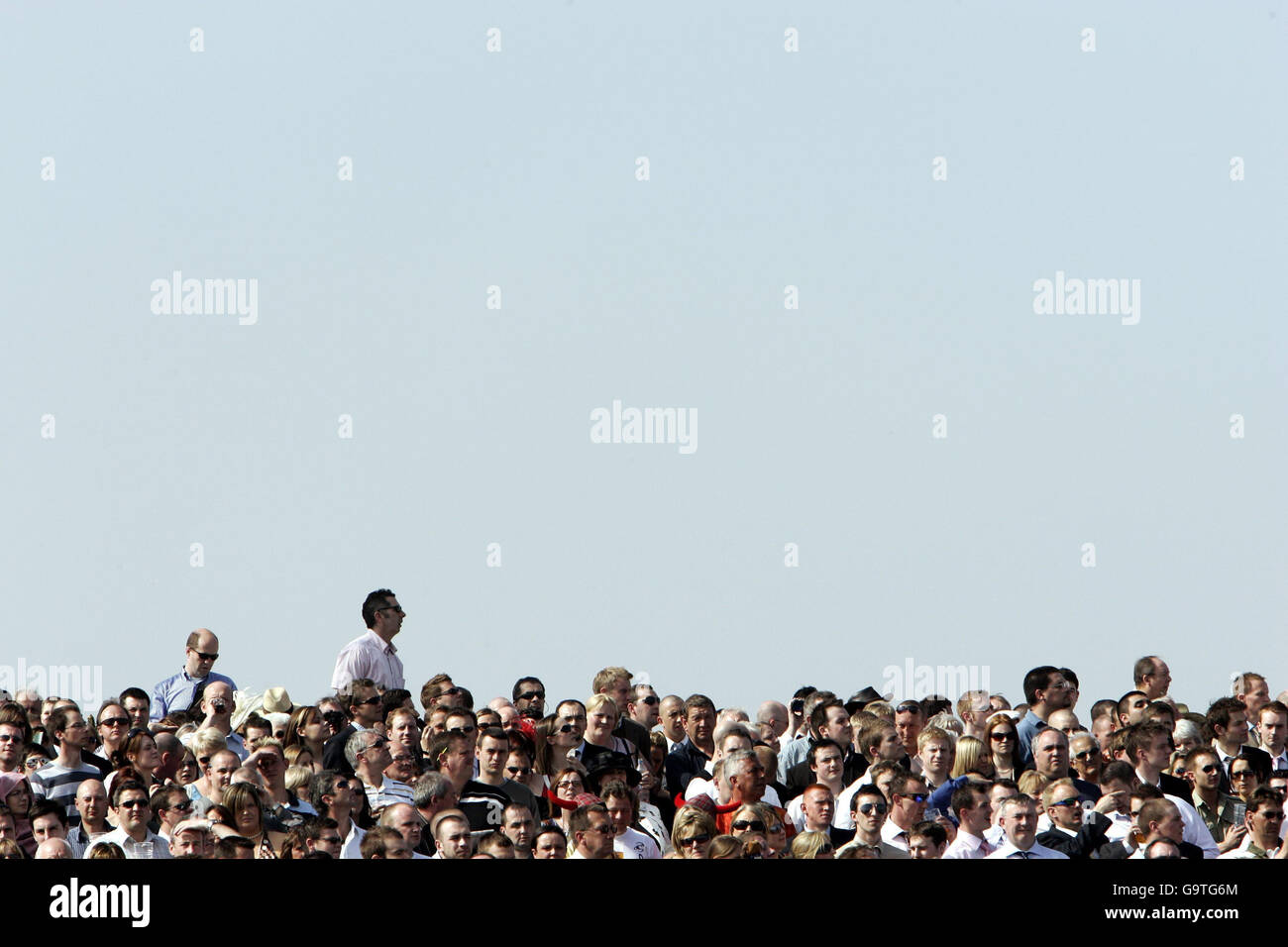 Grand National. Fans watch the The Baltika Beer Aintree Hurdle Race, at ...