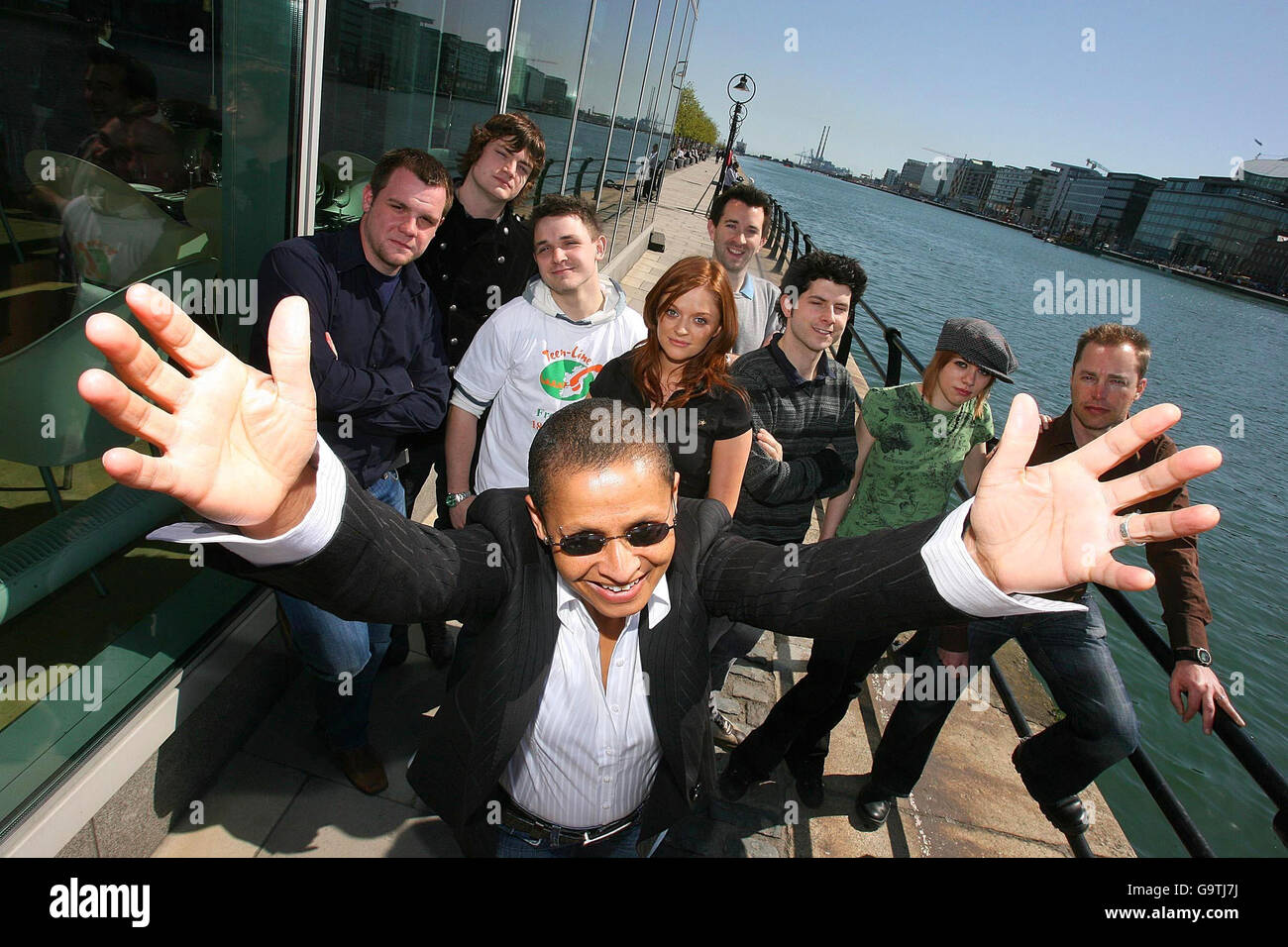 Singer Shaz Oye, centre, with (from the left) Mike Hogan, Richie, Johnny Ward, Shine, Claire O'Dowd - presenter of 'Making Waves', Rory Dungan, Rick Caulfield, Leanne Harte and Eric Eckhart, stand by the River Liffey in Dublin, to raise cash for Teenline Ireland, a helpline set up to stem suicide among young people. Stock Photo