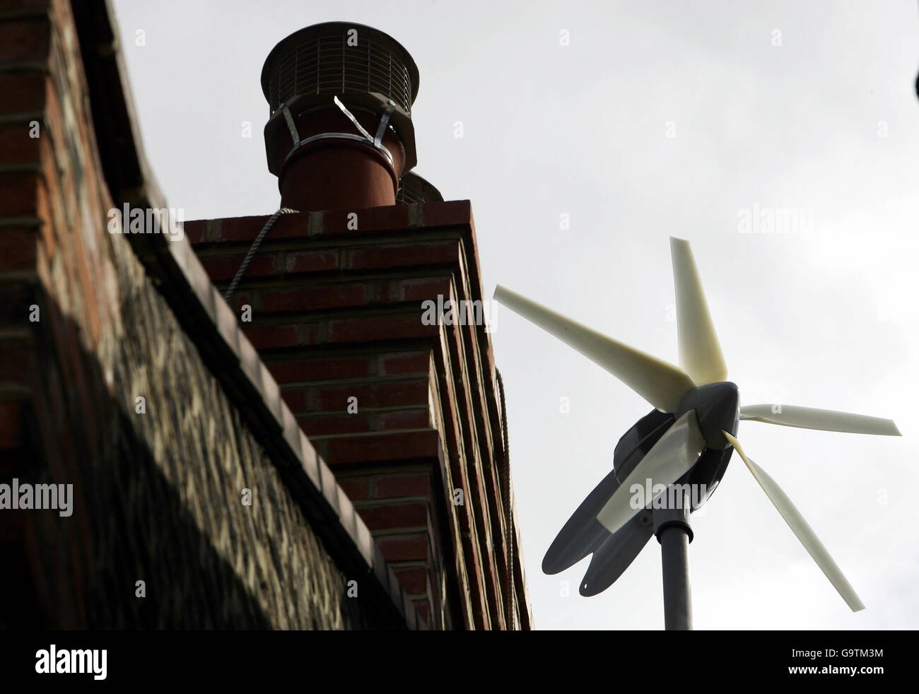 Budget 2007. A workman errects the new wind turbine on Conservative Leader David Cameron's new house in West London. Stock Photo