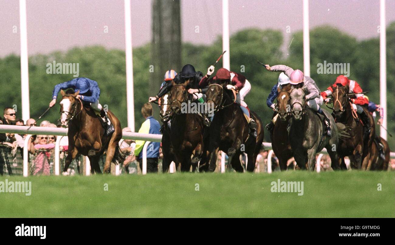 Black Minnaloushe (c) ridden by Johnny Murtagh comes home to win The St. James's Palace Stakes from second placed Noverre (l) ridden by Frankie Dettori and third placed Olden Times ridden by Gerrard Moss Stock Photo