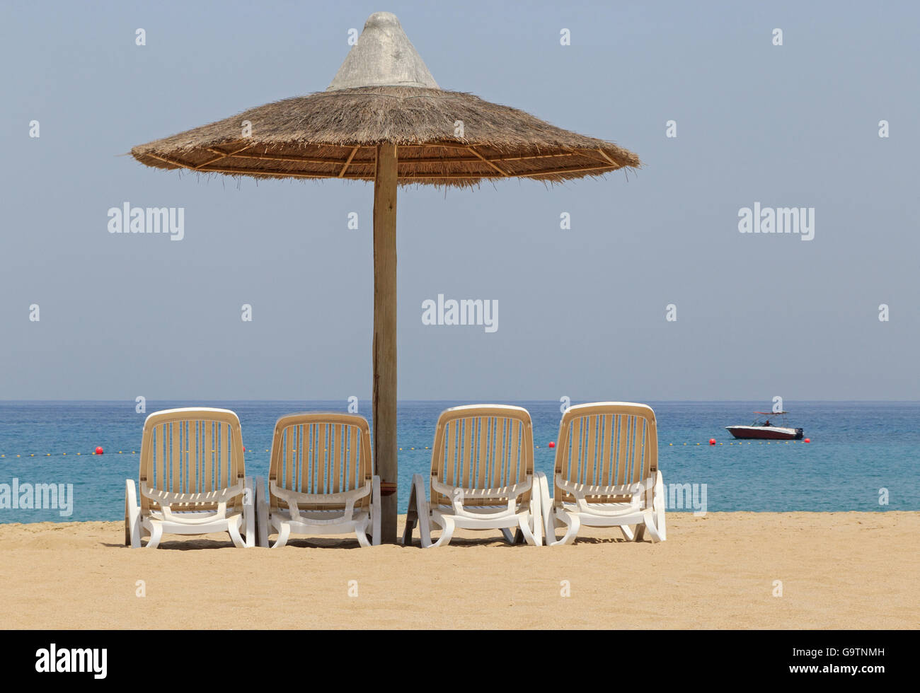 sunshade tent and chairs on beach in Fujairah, UAE Stock Photo