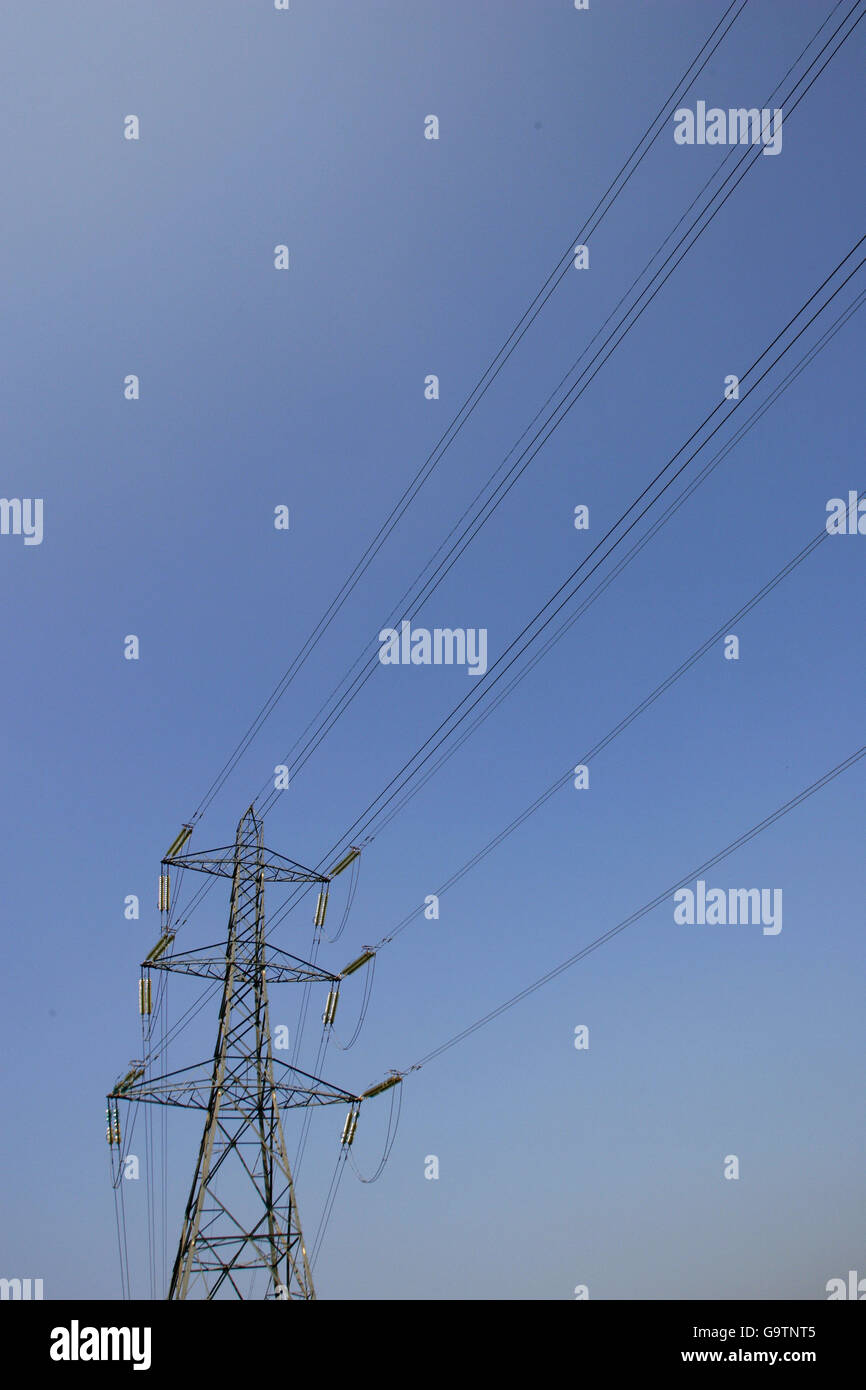 High tension power lines stretch across the Hampshire countryside near