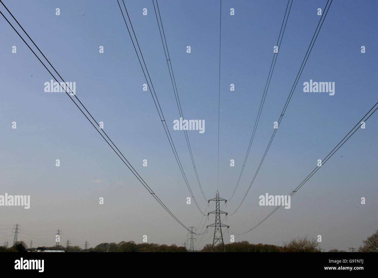 High tension power lines stretch across the Hampshire countryside near