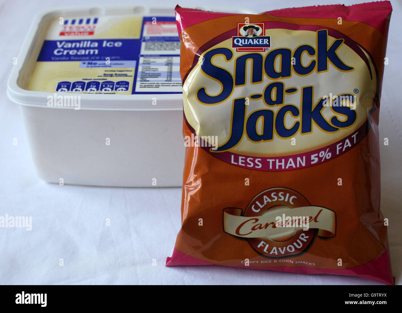 View of a packet of low fat Snack-a-Jacks and a tub of supermarket own brand ice cream, which were used as a comparison in a new survey on sugar content in foods. Stock Photo