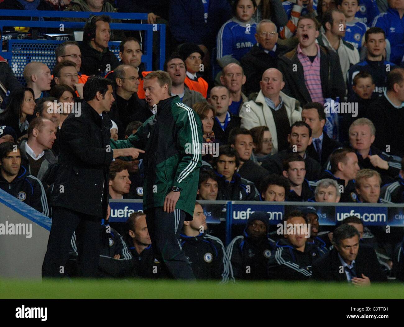 Soccer - UEFA Champions League - Quarter Final - First Leg - Chelsea v Valencia - Stamford Bridge. Valencia coach Quique Sanchez Flores gestures from the touchline to talk to Chelsea manager Jose Mourinho Stock Photo