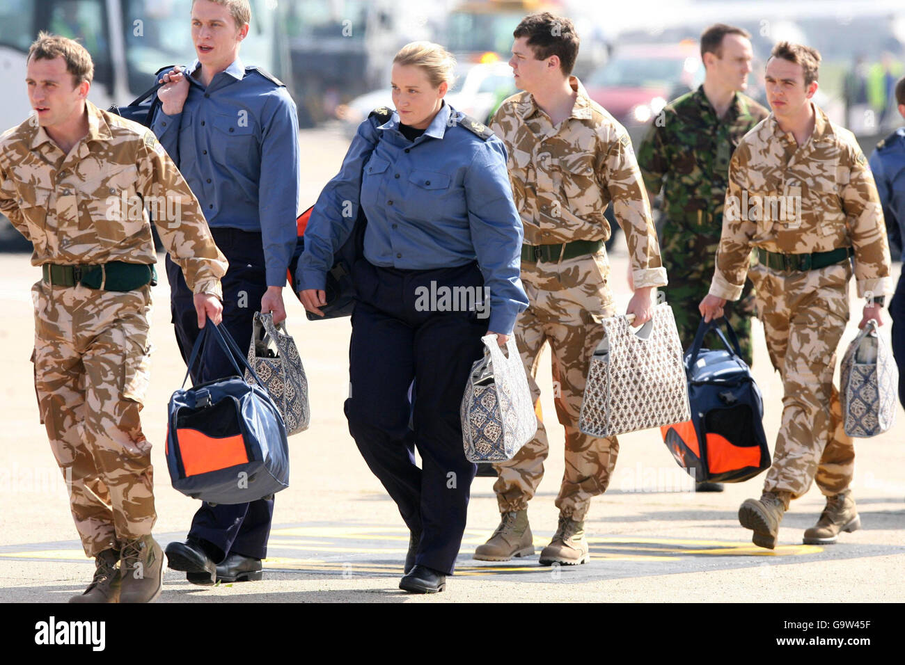 British service personnel (left to right) Gavin Cavendish, Simon Massey, Faye Turney, Joe Tindell and Dean Harris disembark a plane at Heathrow Airport after their return from Iran. Stock Photo