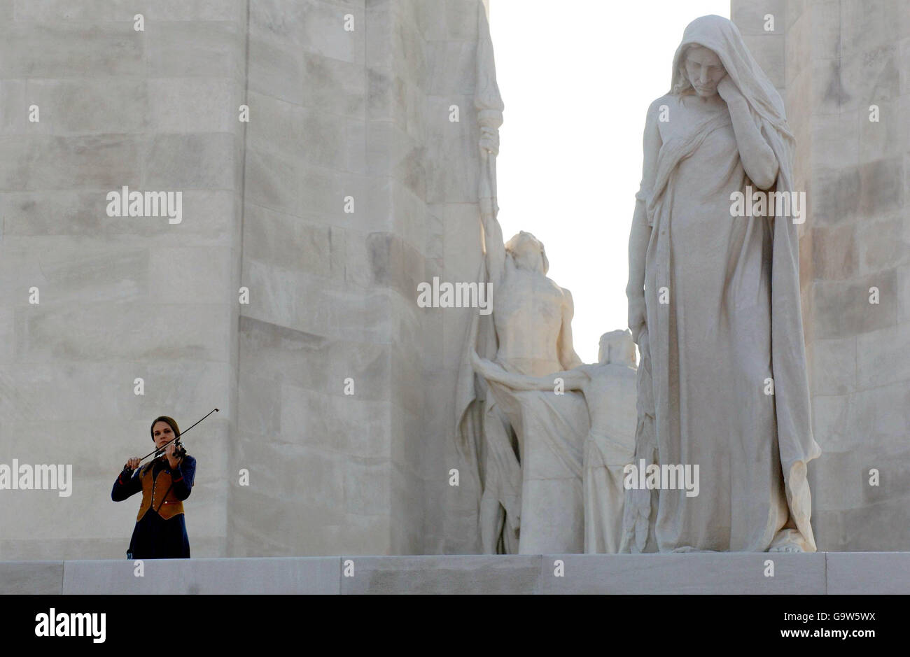 A violinist plays during a ceremony at the Vimy memorial, near Lille in northern France. Stock Photo