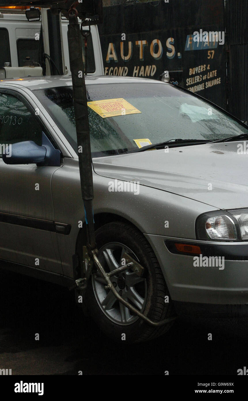Transport Stock. TRANSPORT Stock: Untaxed car towed away by police in east London. Stock Photo
