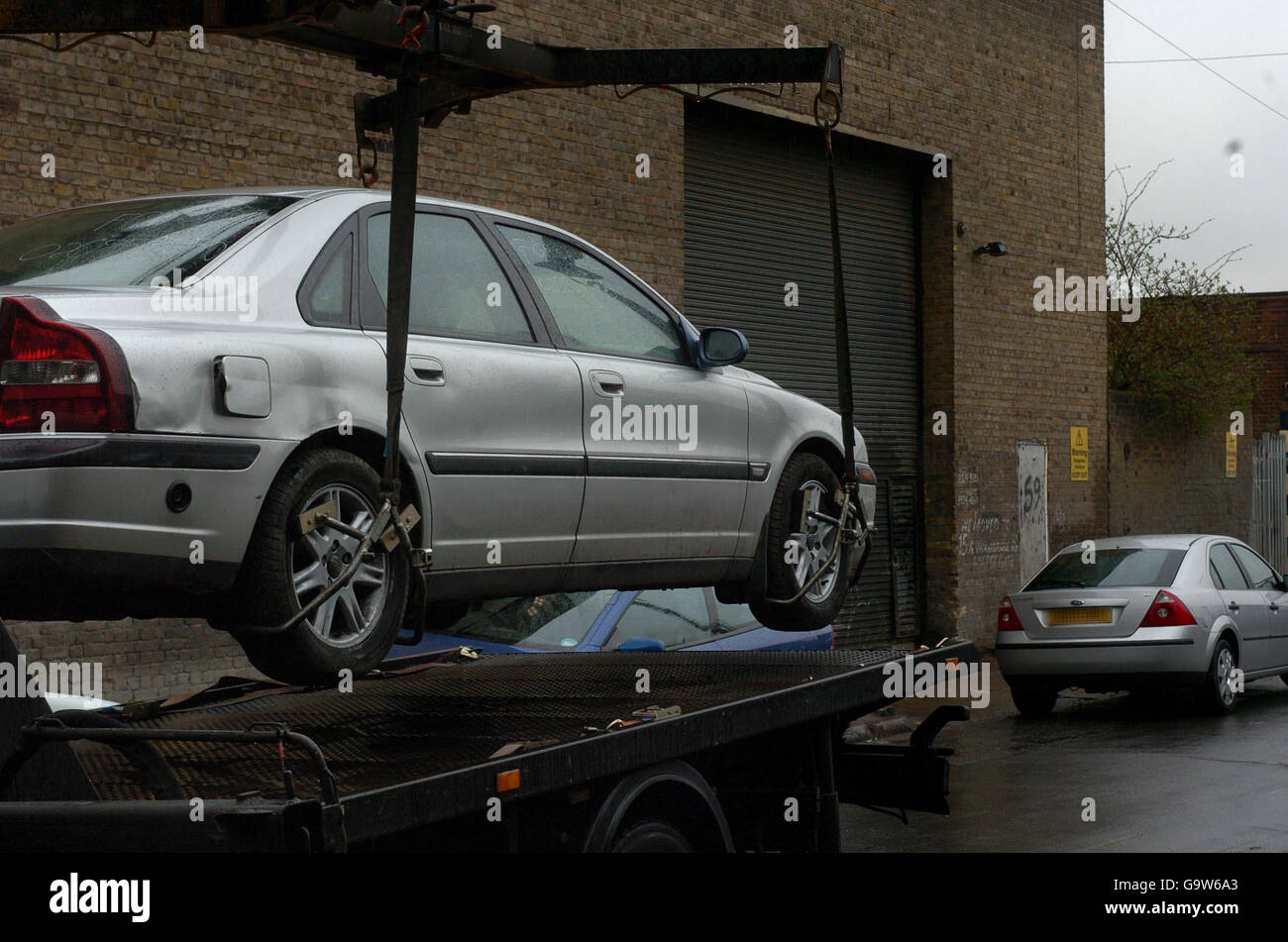 TRANSPORT Stock: Untaxed car towed away by police in east London. Stock Photo