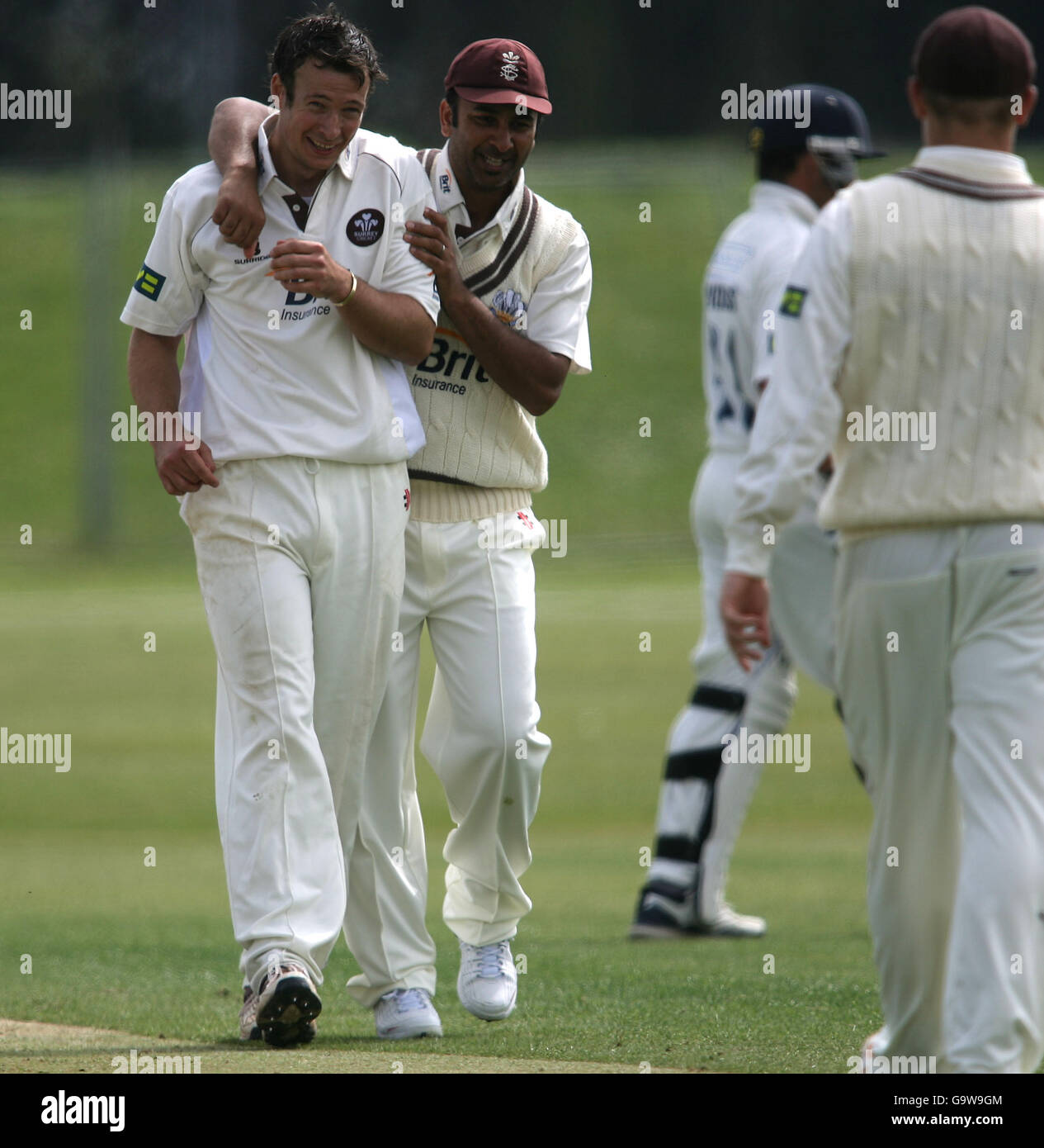 Surrey's bowler Richard Clinton celebrates taking his second wicket with coach Nadeem Shahid Stock Photo