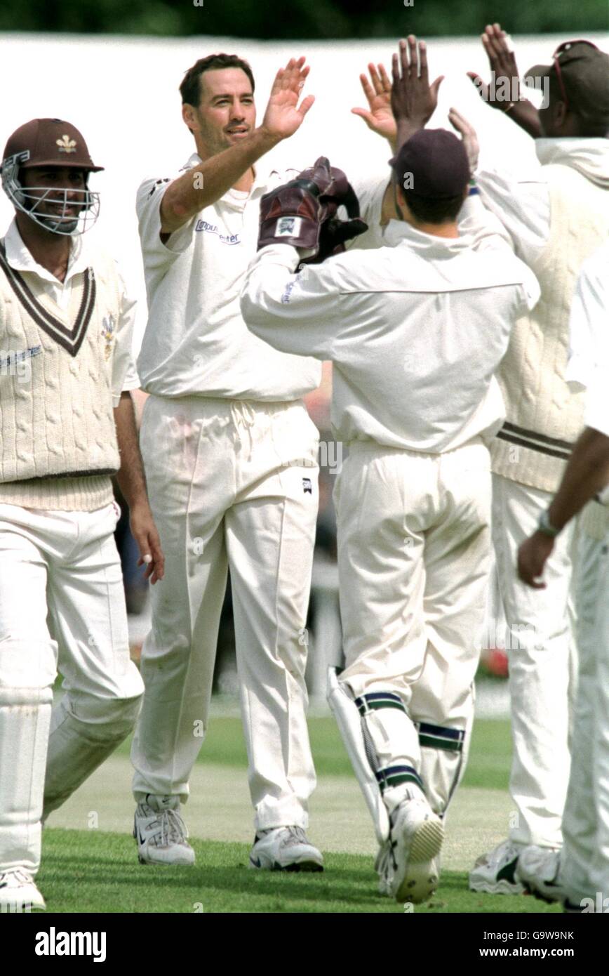 Surrey's Martin Bicknell celebrates with his team mates after taking his seventh wicket of Northamptonshire's second innings - David Ripley caught by Gary Butcher Stock Photo