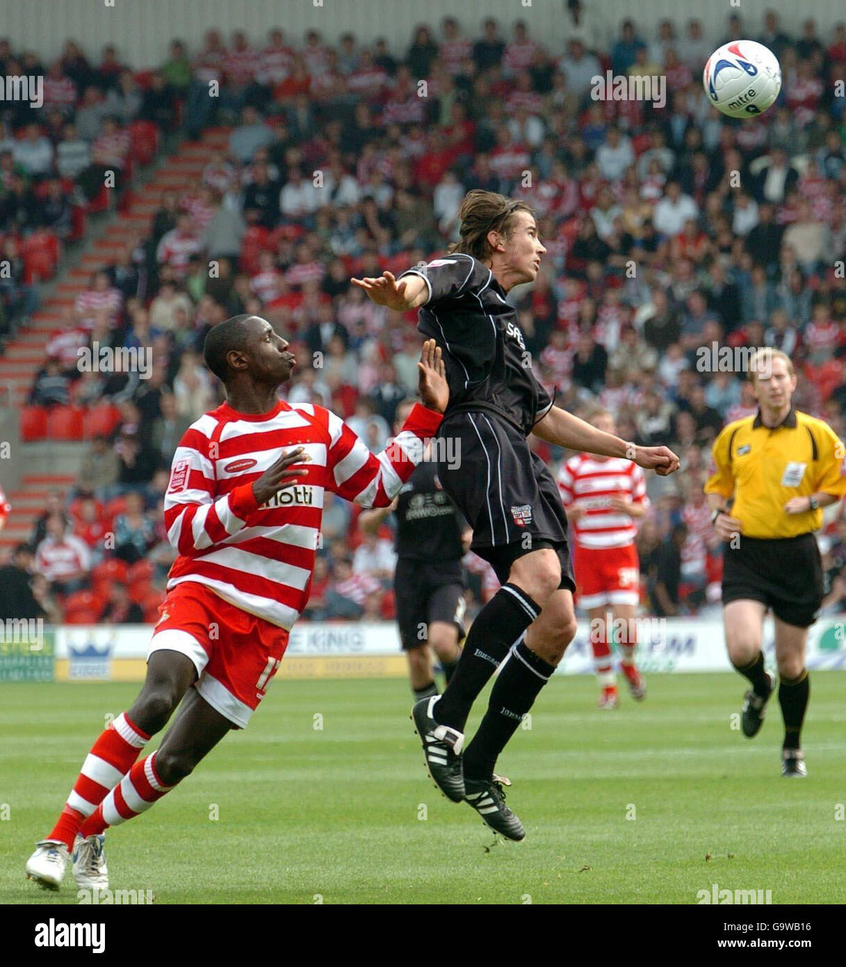 Doncaster's Jonathan Forte (left) in action with Brentford's Adam Griffiths during the Coca-Cola Football League One match at the Keepmoat Stadium, Doncaster. Stock Photo