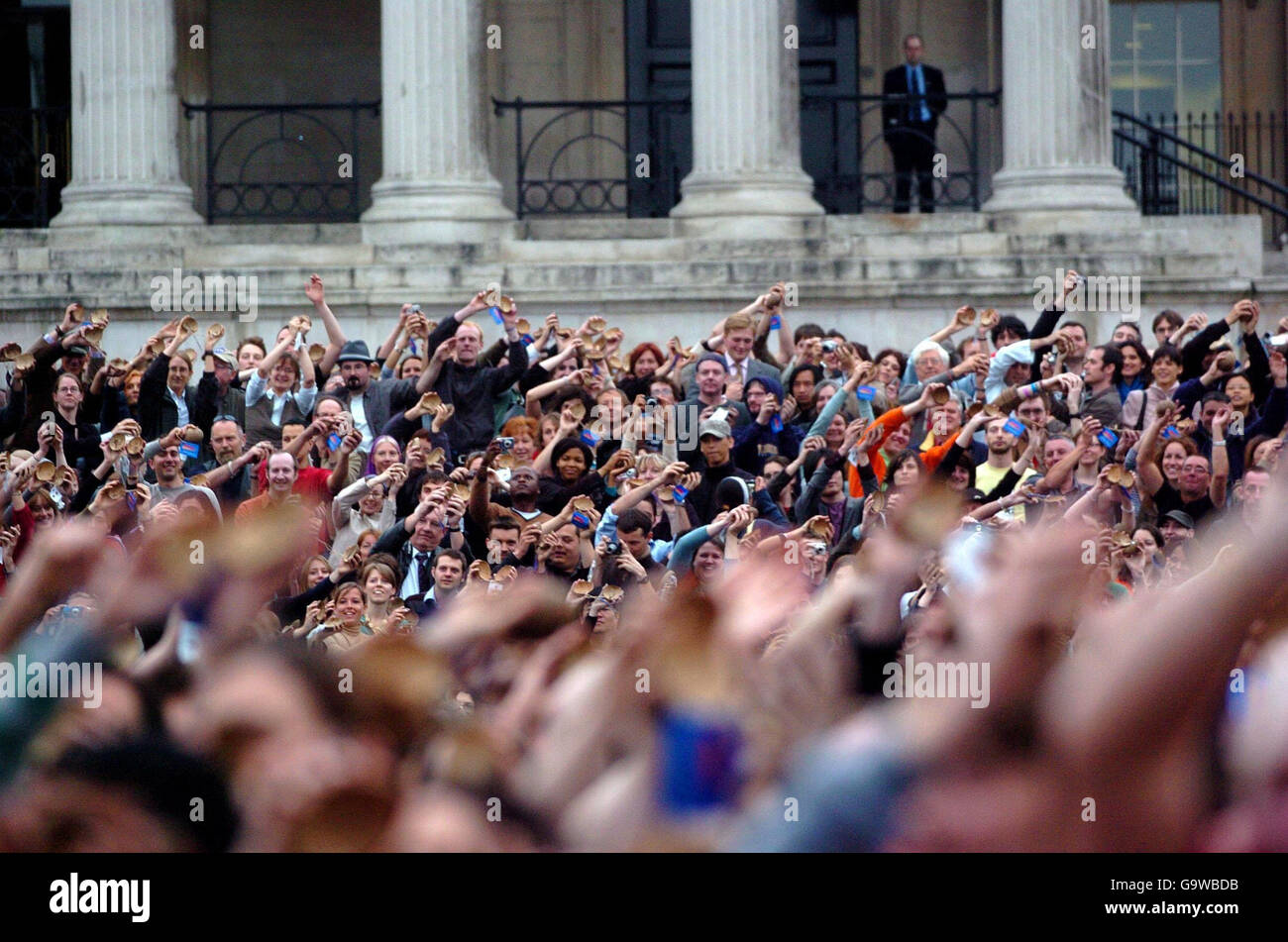 A 'Coconut Orchestra' (involving cast members of the West End hit, 'Spamalot') attempts to set a new world record (established by the 1,785 people who took part in a similar event last year in New York) in time to the Monty Python classic 'Always Look on the Bright Side of Life', in Trafalgar Square, central London. Stock Photo