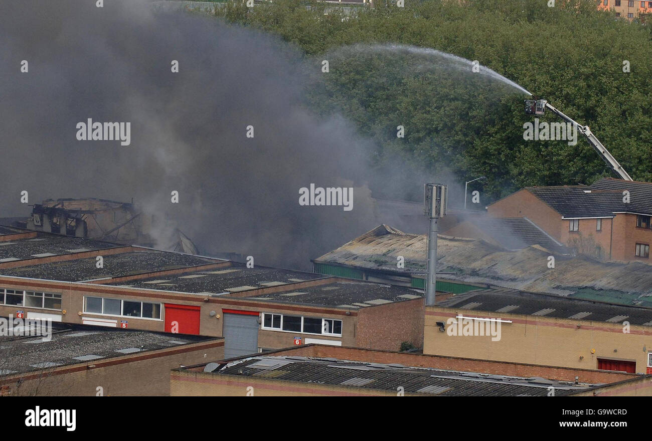 Blaze causes rail travel chaos. A blaze breaks out in buildings at New Cross in south east London close to a busy railway junction.. Stock Photo