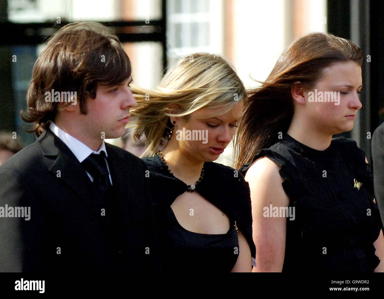 (Left to right) boyfriend Ryan Garside, and sisters Lisa Hawker and Louise Hawker at the funeral service of Lindsay Ann Hawker at Coventry Cathedral. Stock Photo