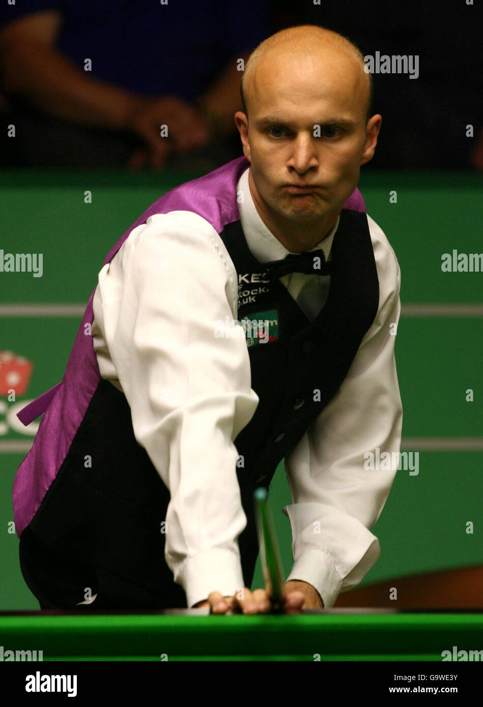 Andy Hicks in action against Ali Carter during the first round match of the World Snooker Championships at the Crucible Theatre, Sheffield. Stock Photo