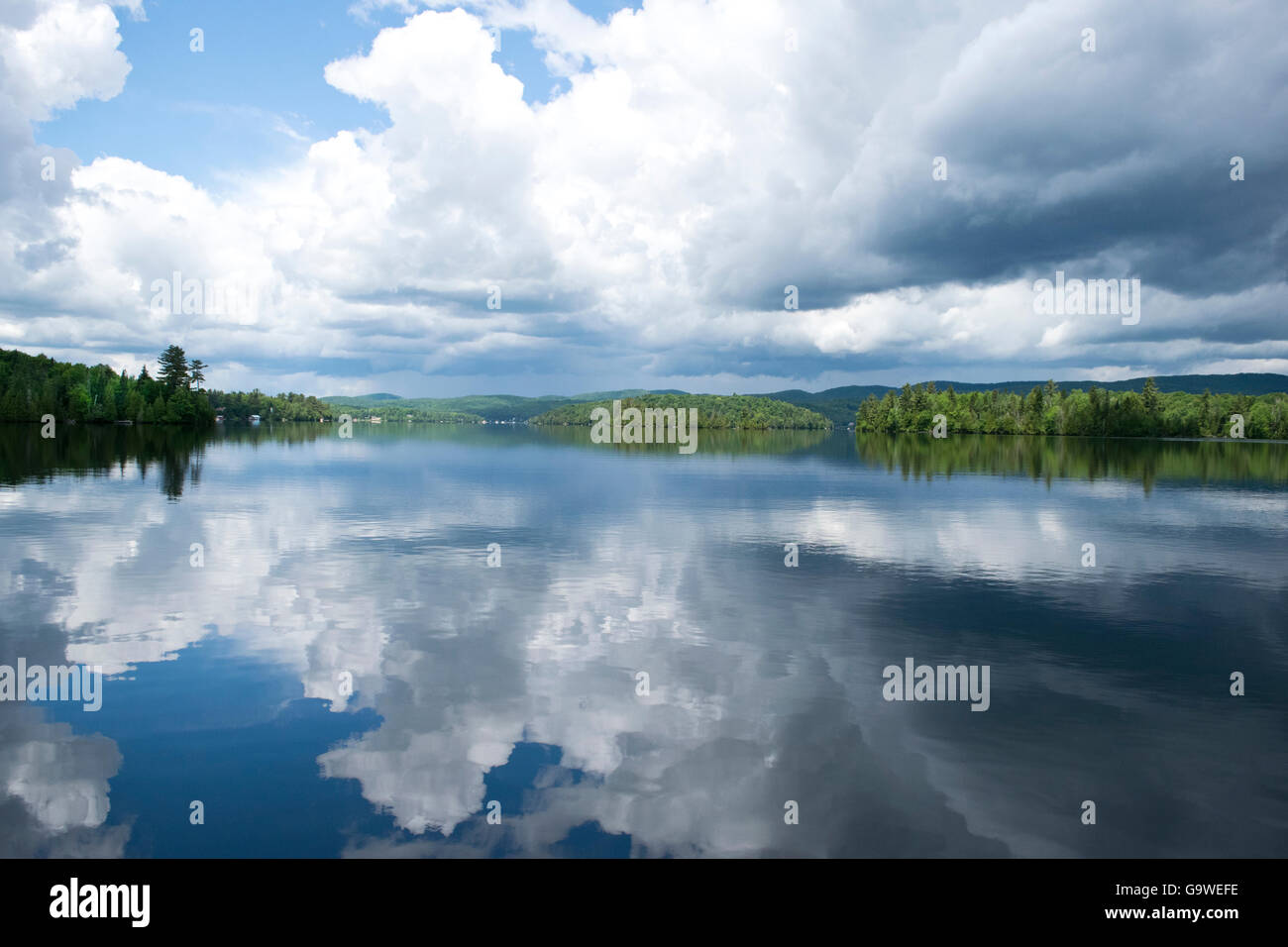Reflections of clouds on Lac des Iles Stock Photo Alamy