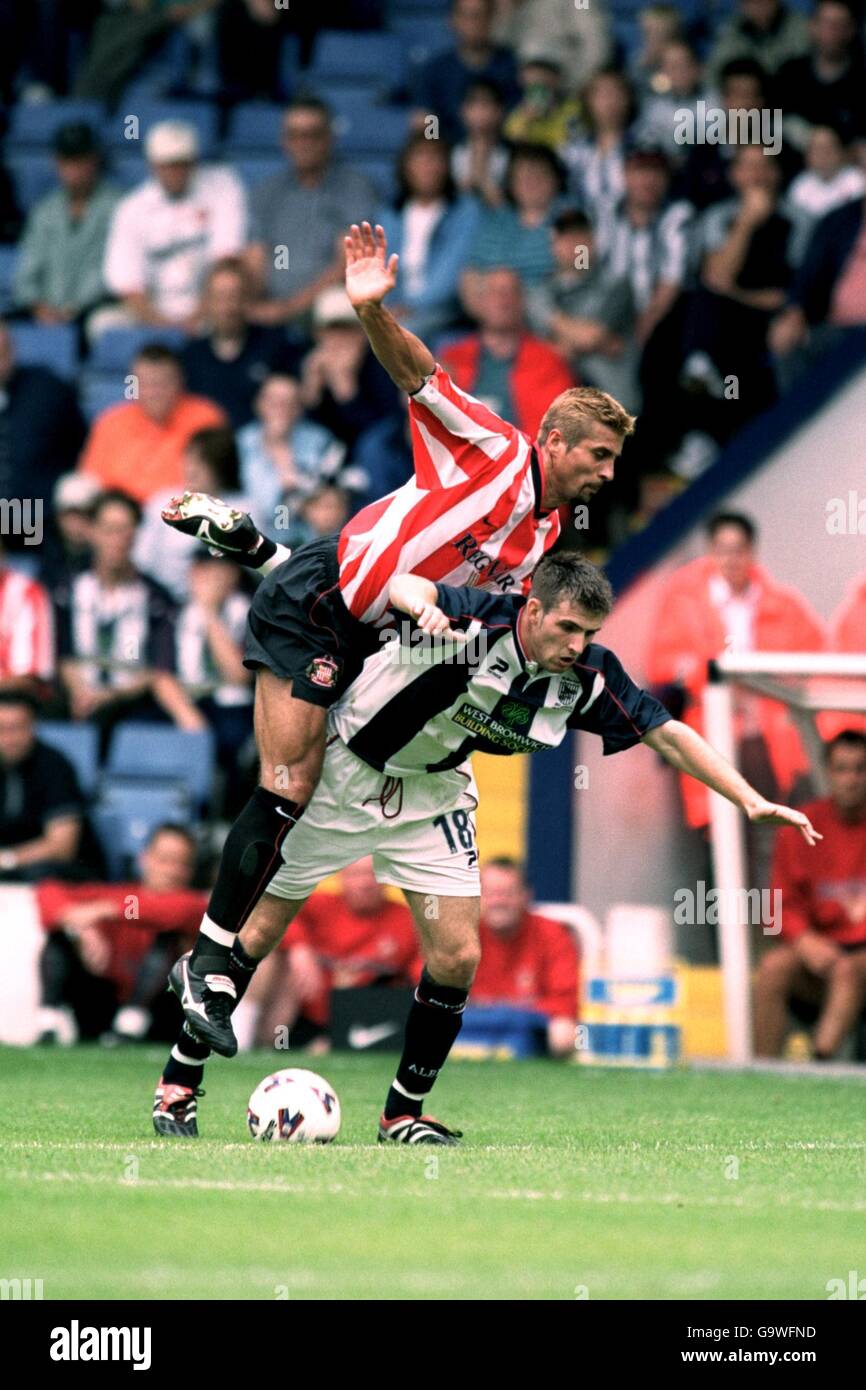 (L-R) Sunderland's Emerson Thome flies over the back of West Bromwich Albion's Scott Dobie Stock Photo