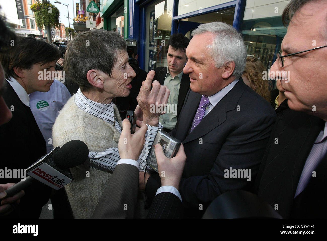Taoiseach Bertie Ahern listens to the health concerns of Bridget Kelly on Dublin's Henry Street as he canvasses for the general election. Stock Photo