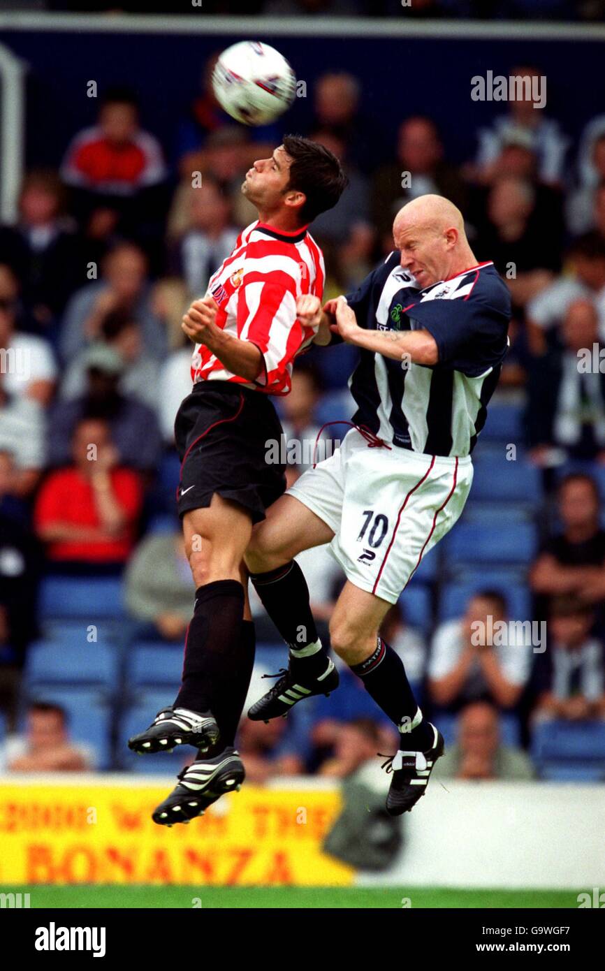 Soccer - Friendly - West Bromwich Albion v Sunderland. West Bromwich Albion's Lee Hughes (r) is beaten to a header by Sunderland's Bernt Haas (l) Stock Photo