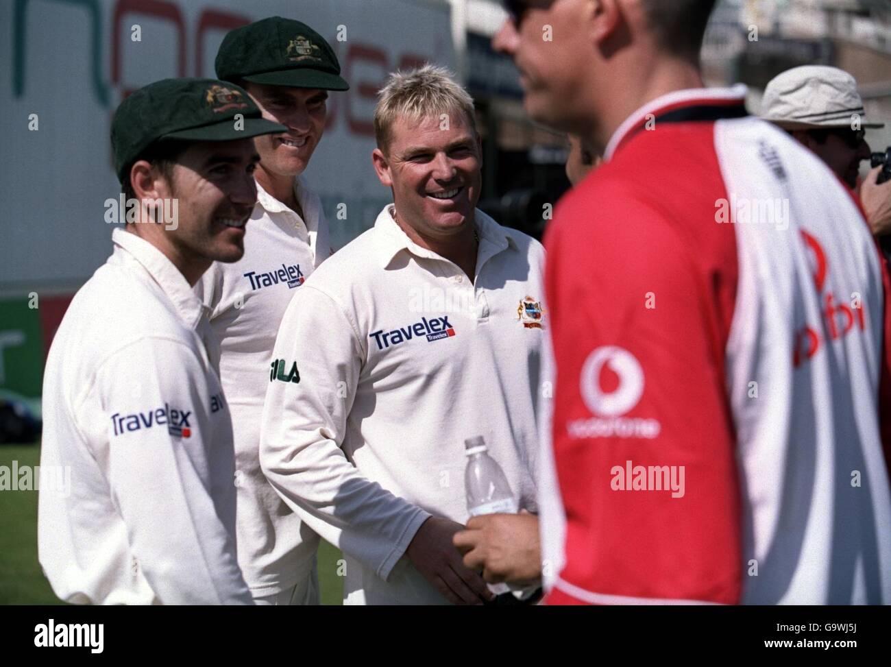 (L-R) Australia's Justin Langer, Matthew Hayden and Shane Warne seem to be laughing at the England players as they walk off Stock Photo