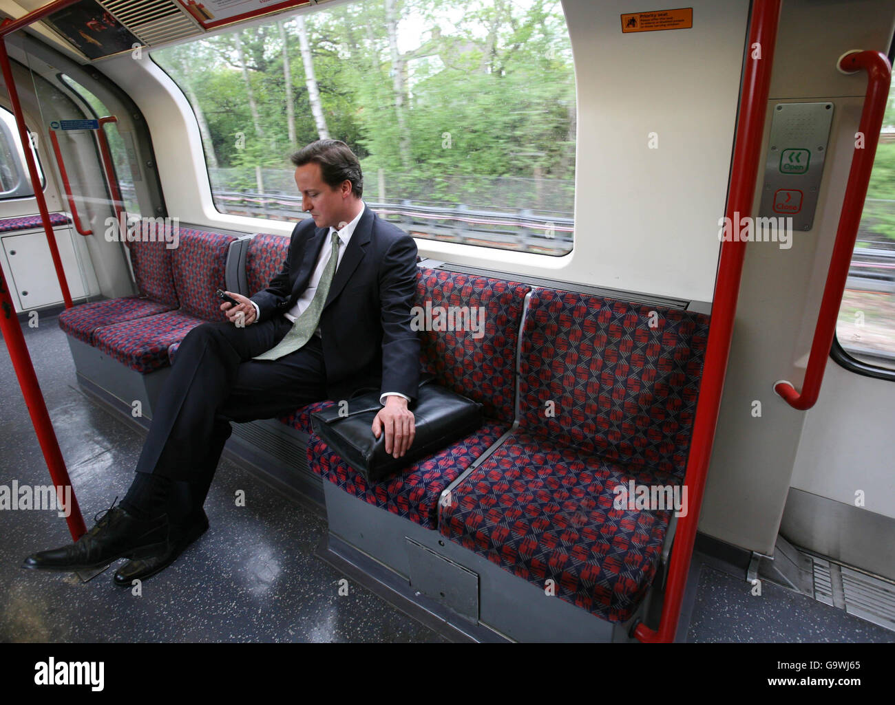 Conservative Party leader David Cameron takes the tube back to central London from Epping after visiting community enterprise initiative 'The Box' in Epping, Essex, where he discussed the importance of young people playing a full role in society. Stock Photo