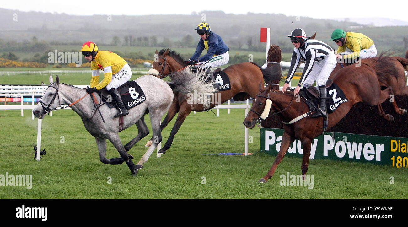 Horse Racing - Guinness Day - Punchestown. Ruby Walsh on Neptune Collonges leads the pack at the last fence to win the Guinnes Gold Cup at Punchestown Racecourse. Stock Photo