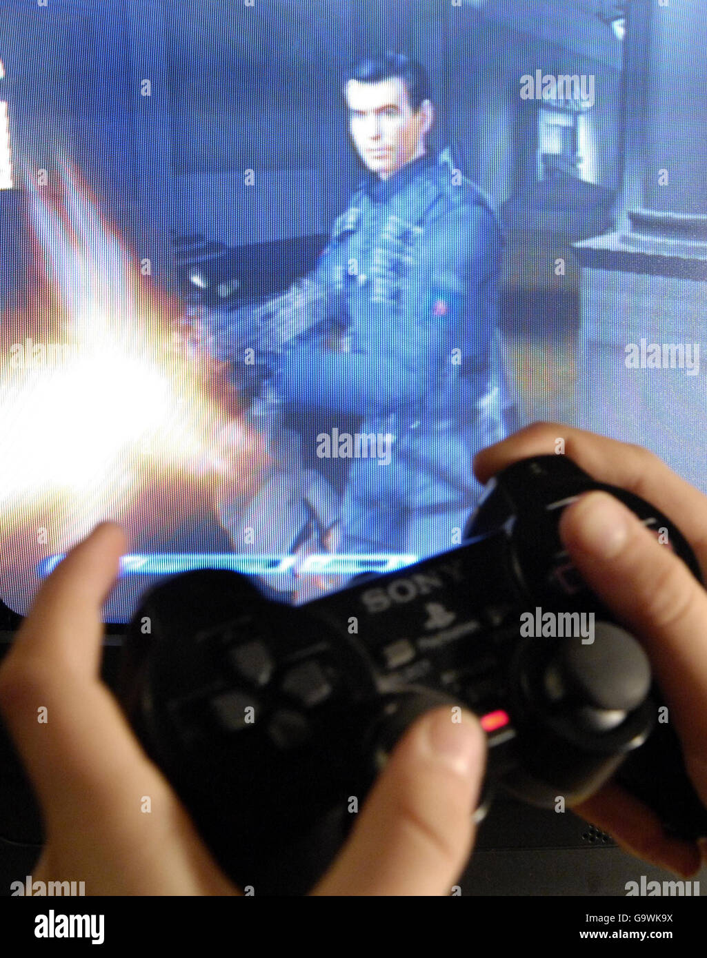 Gadget stock. A boy playing on a Play Station computer game. Stock Photo
