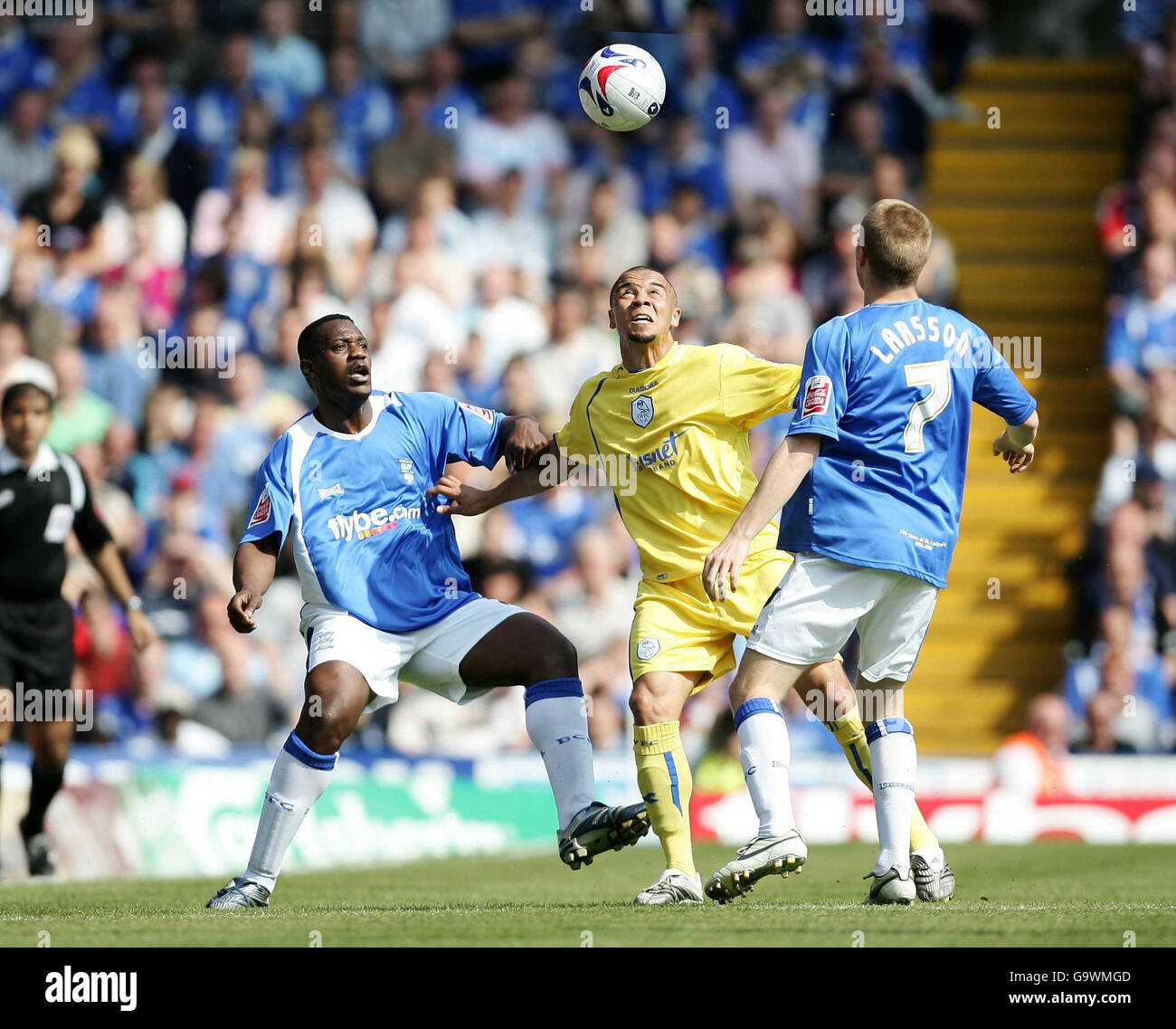 Sheffield Wednesday's Deon Burton (centre) is challenged by Birmingham's Bruno N'Gotty and Sebastian Larsson (right) during the Coca-Cola Football Championship match at St Andrews, Birmingham. Stock Photo