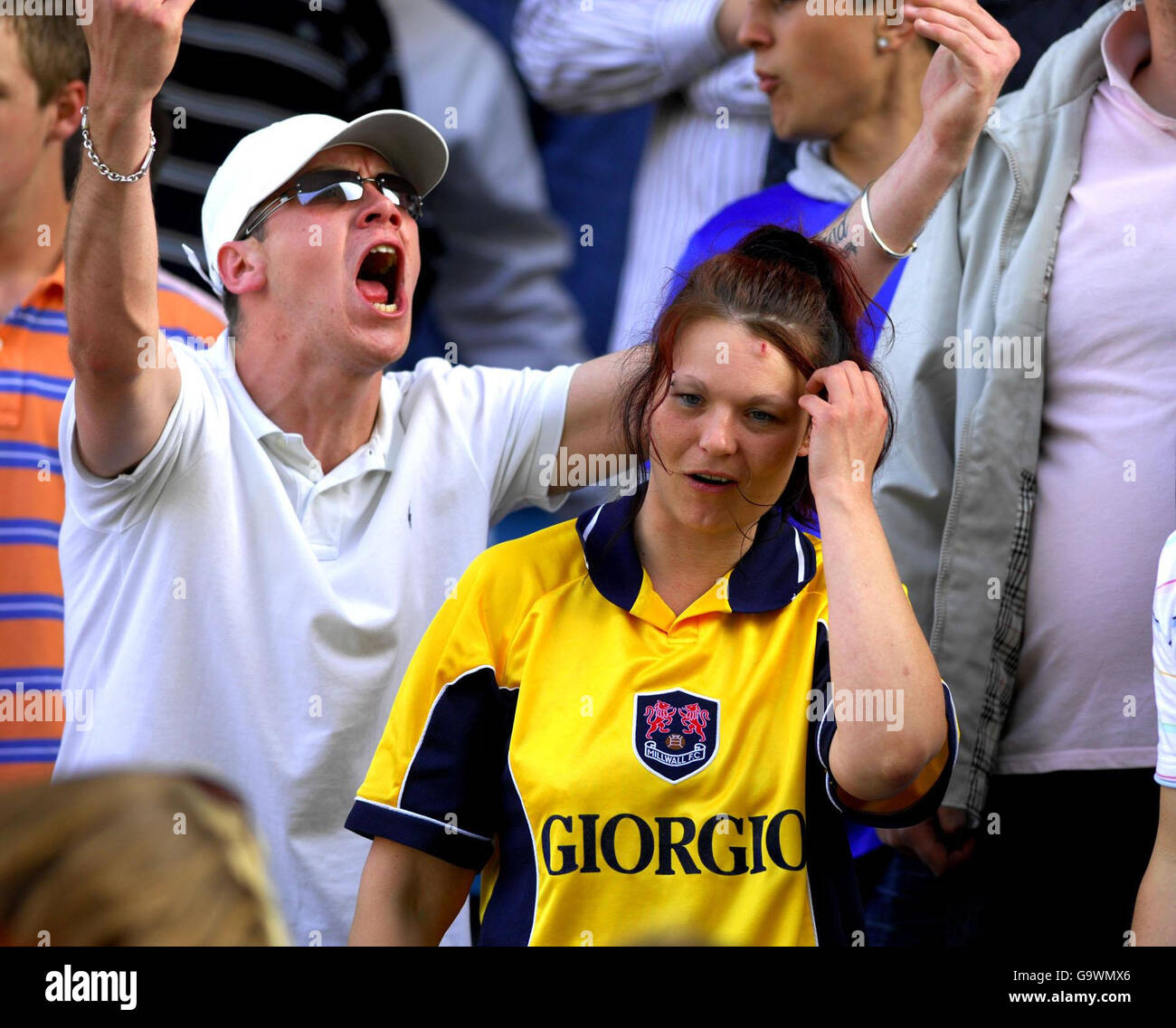 A female Millwall fan with a cut head from a coin thrown by Bristol City fans during the Coca-Cola Football League One match at the New Den, Millwall. Stock Photo