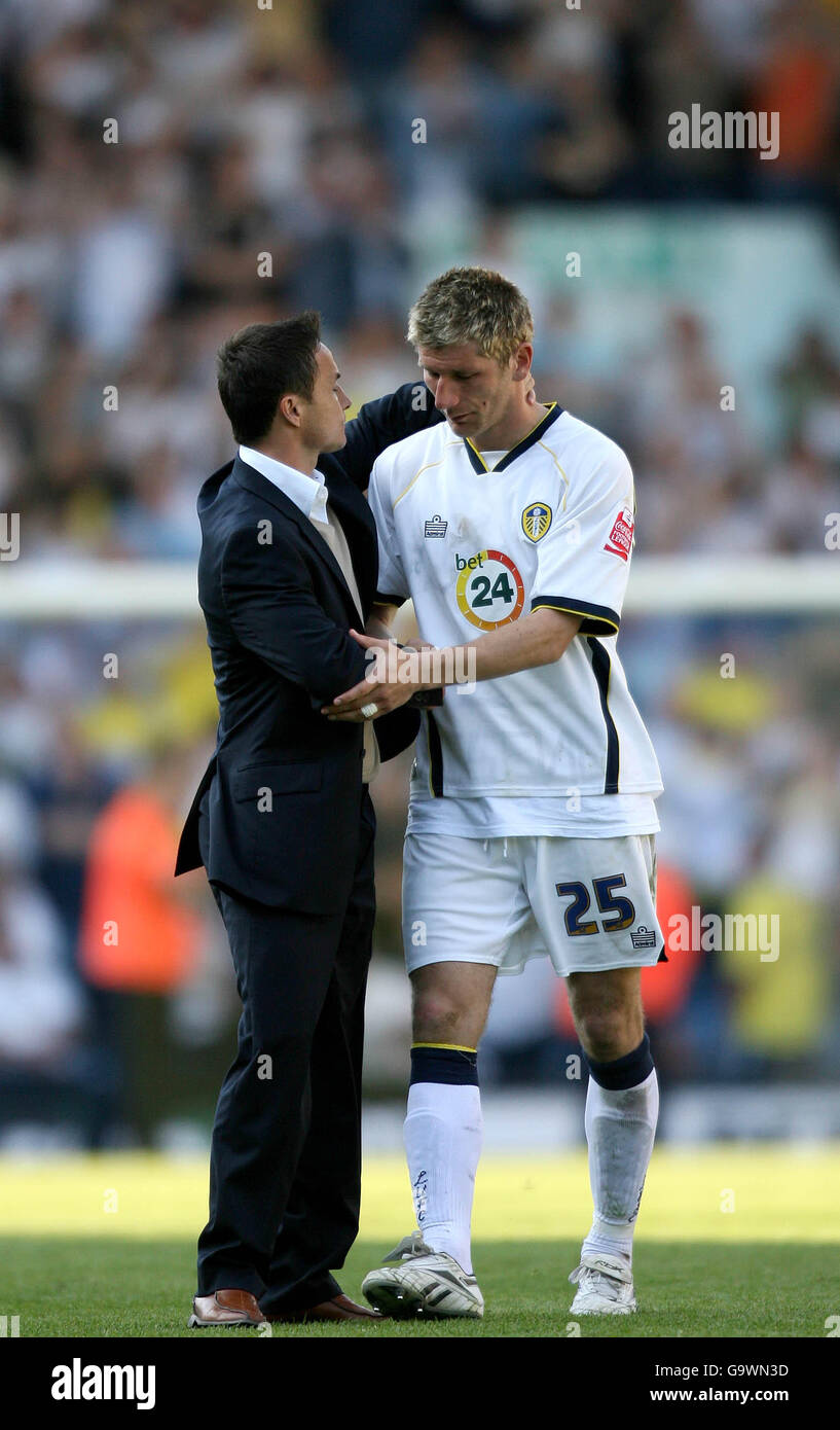 Leeds United's manager Dennis Wise consoles goal scorer Richard ...