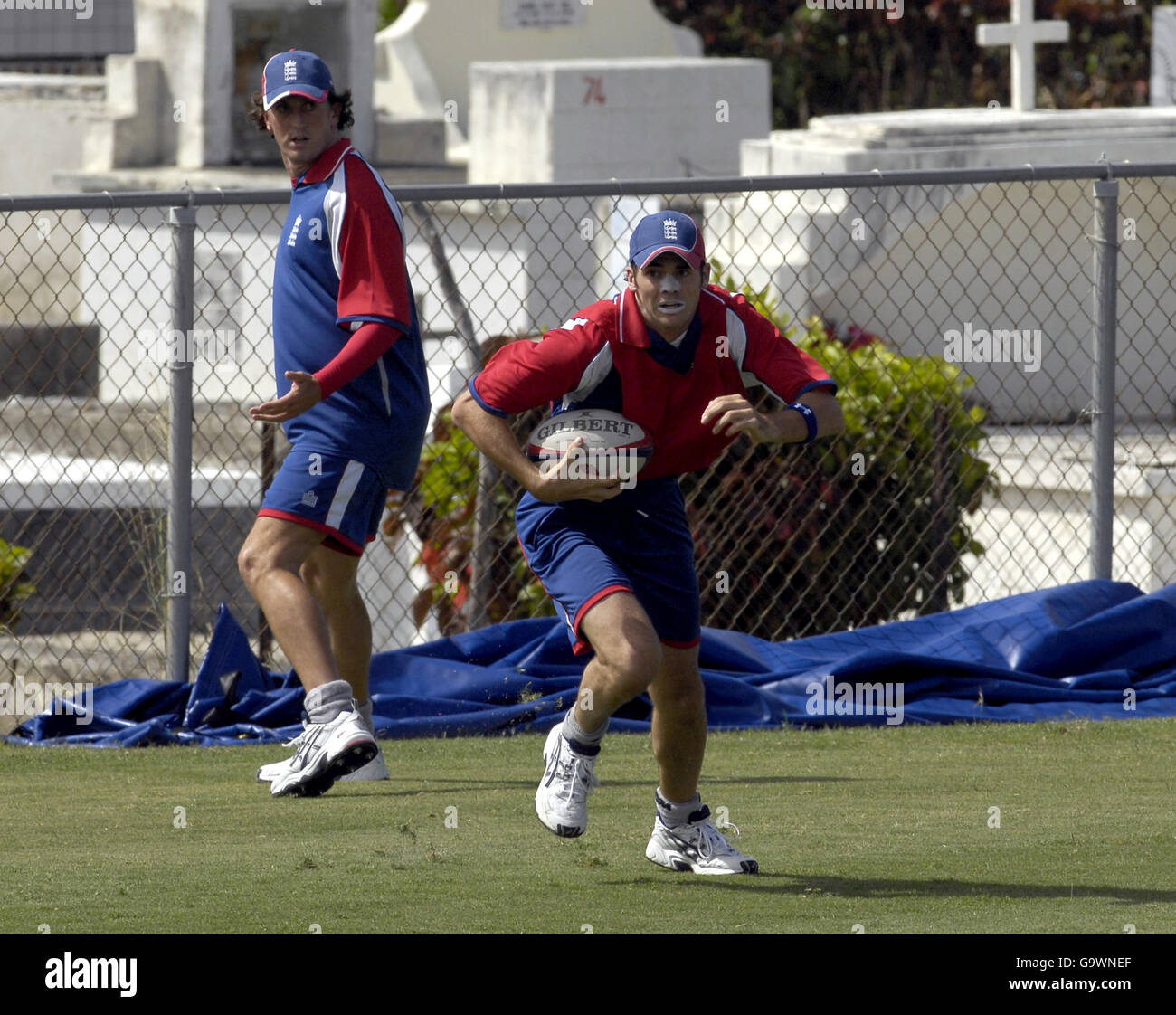 England's James Anderson and Jon Lewis (left) play touch rugby before a ...