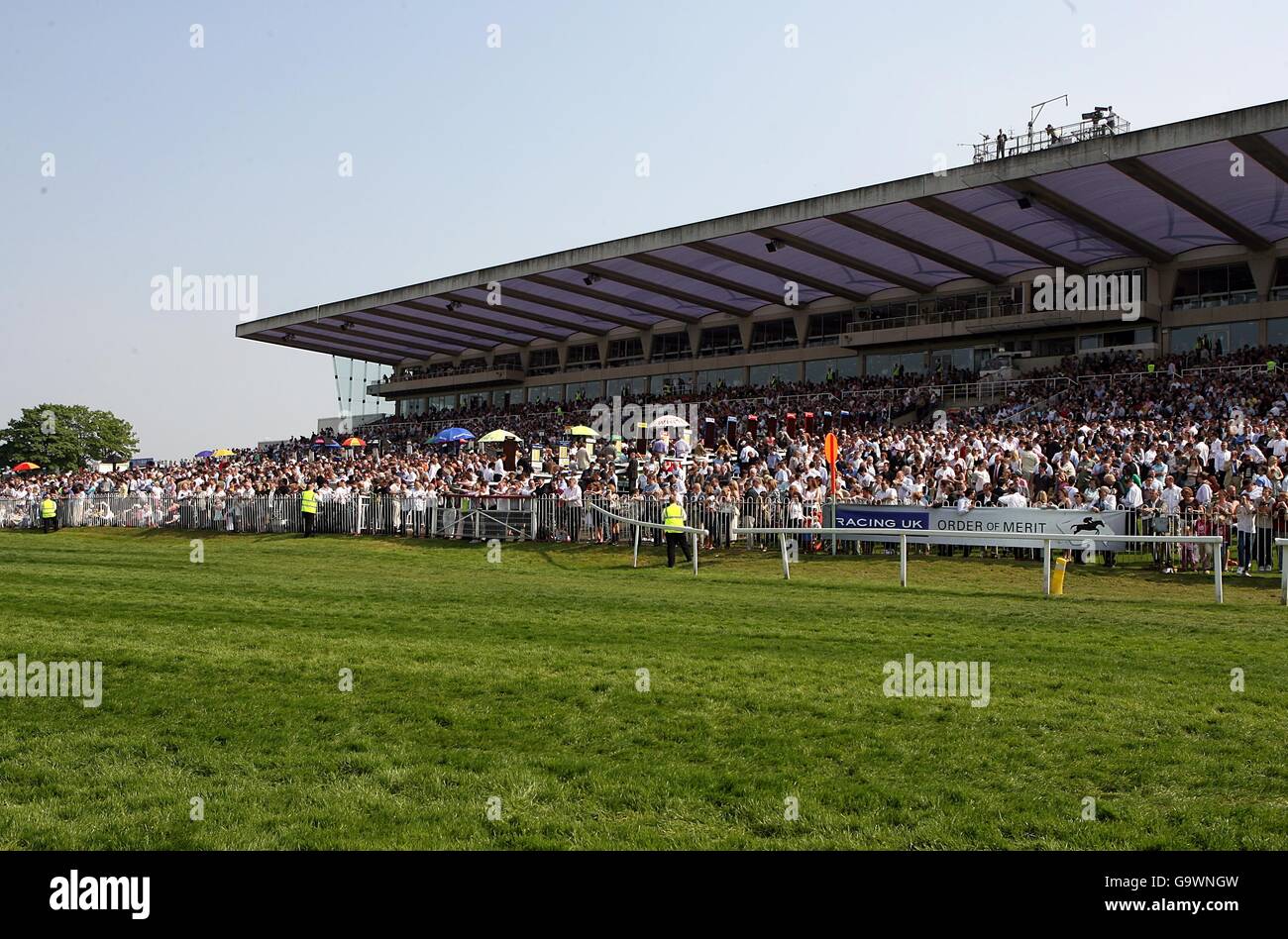 Horse Racing - Betfred Gold Cup Meeting - Sandown Park. A view of the grandstand, trackside at Sandown Park. Stock Photo