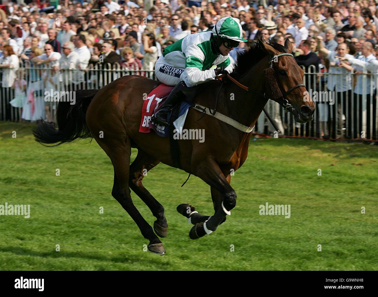 Hot Weld, ridden by jockey Graham Lee, during the Betfred Gold Cup Handicap Chase, at Sandown Park. Stock Photo