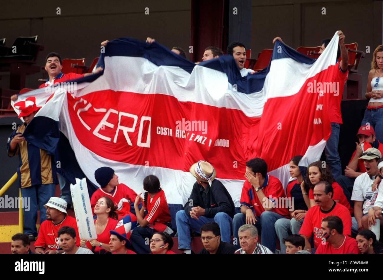 The costa rican fans with a giant national flag hires stock