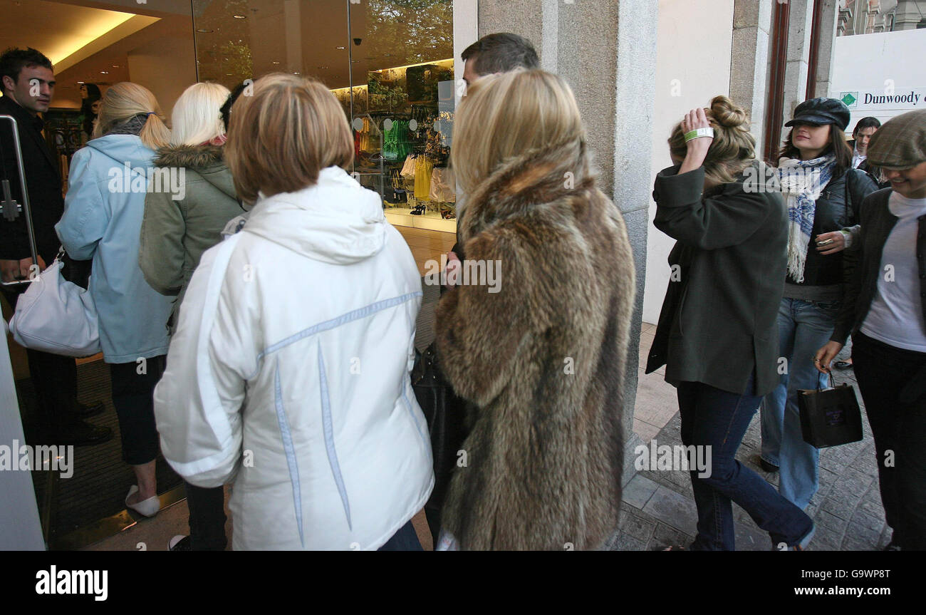 Members of the public enter Dublin's Topshop store after waiting outside  for the doors to open on the first full shopping day of the store selling  the Kate Moss range Stock Photo -