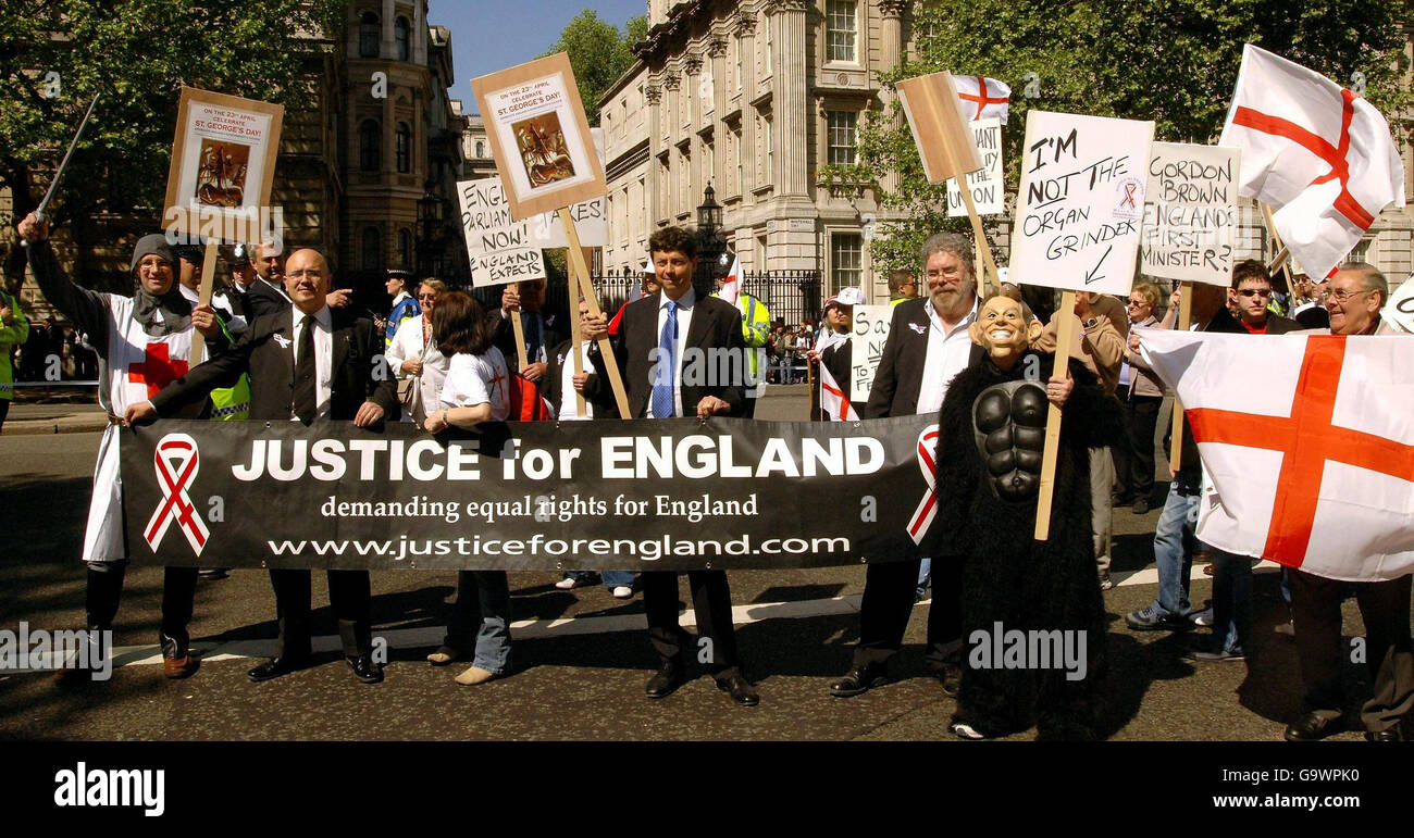 A group of protestors stand in Whitehall opposite Downing Street, calling for the resumption of an English Parliament, during a demonstration for the return of English people to run England for the English, in Westminster Central London. Stock Photo