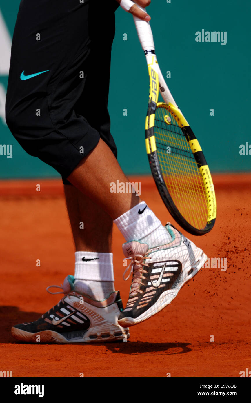 Spains rafael nadal clears the clay of his trainers hi res stock