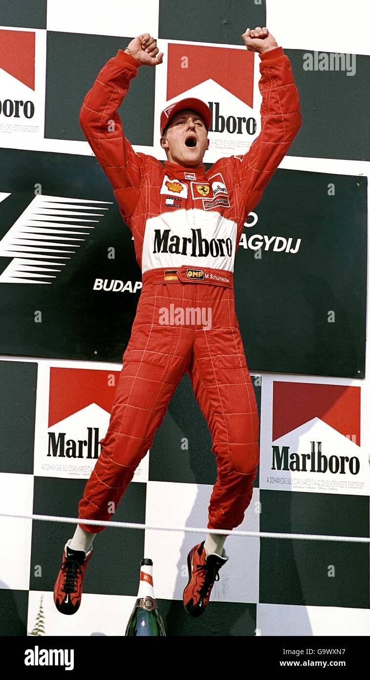 Michael Schumacher celebrates clinching the World Championship with his