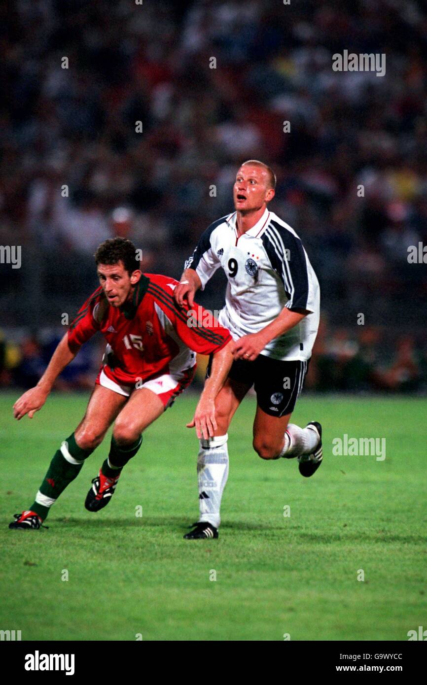 Hungary's Janos Hrutka (l) and Germany's Carsten Jancker (r) go for the ball Stock Photo