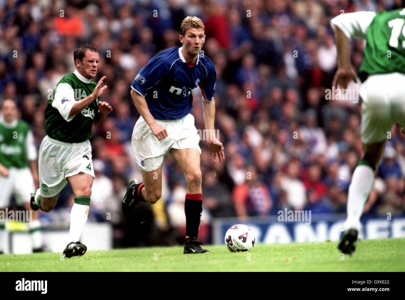 Scottish Soccer - Bank of Scotland Premier League - Rangers v Hibernian. Rangers' Tore Andre Flo (r) gets away from Hibernian's John O'Neil (l) Stock Photo