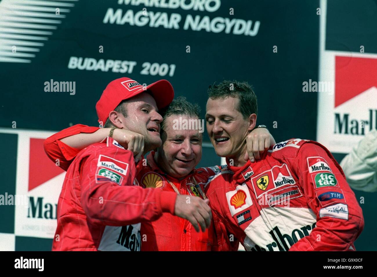 Rubens Barrichello (l) and Michael Schumacher (r) celebrate winning the