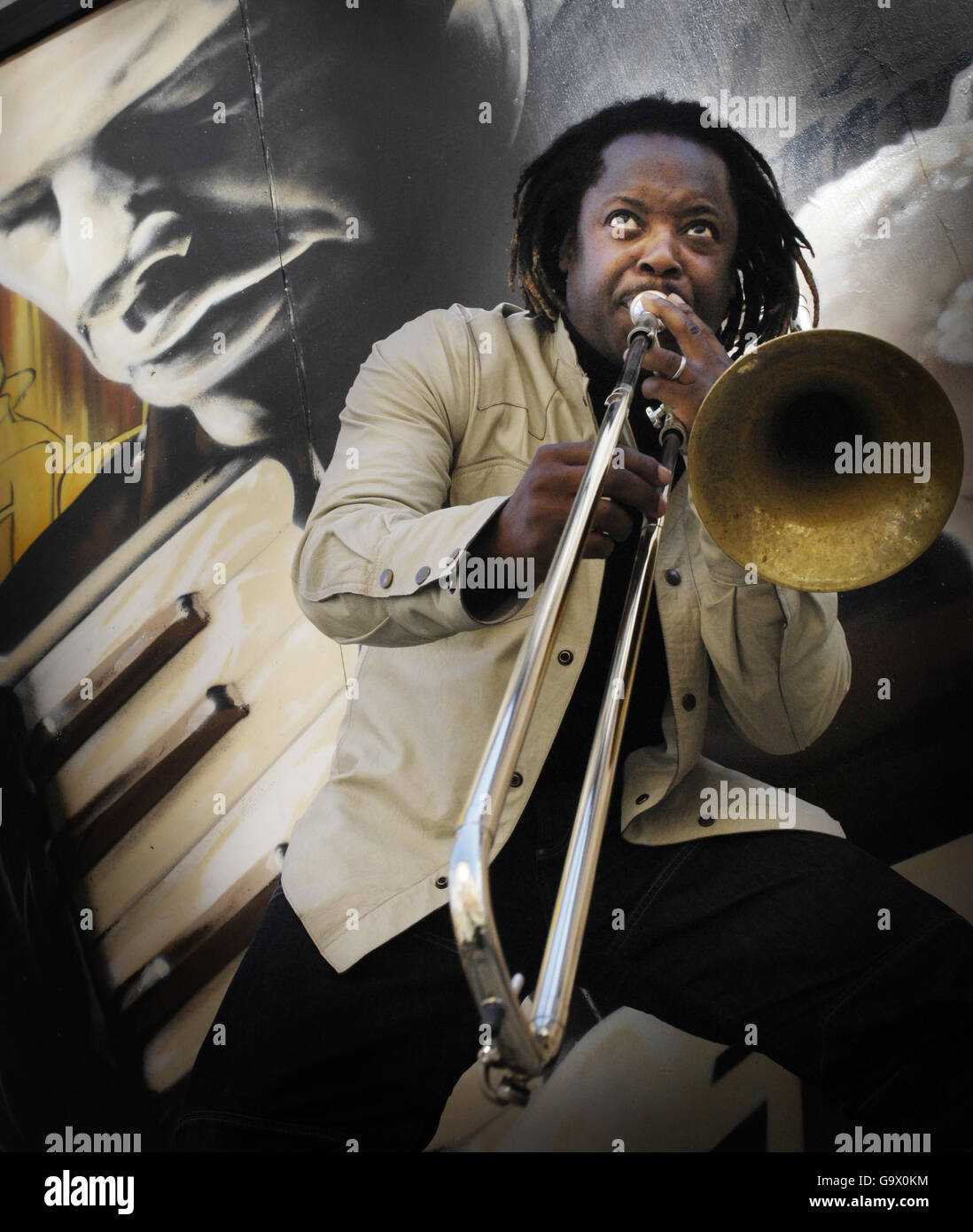 Guest Program Director, Dennis Rollins plays his trombone in Glasgow city centre during the launch of the 21st Glasgow International Jazz Festival. Stock Photo
