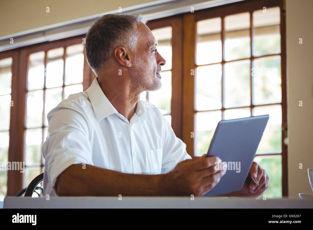 Human Using Tab Man using a tablet Stock Photo - Alamy