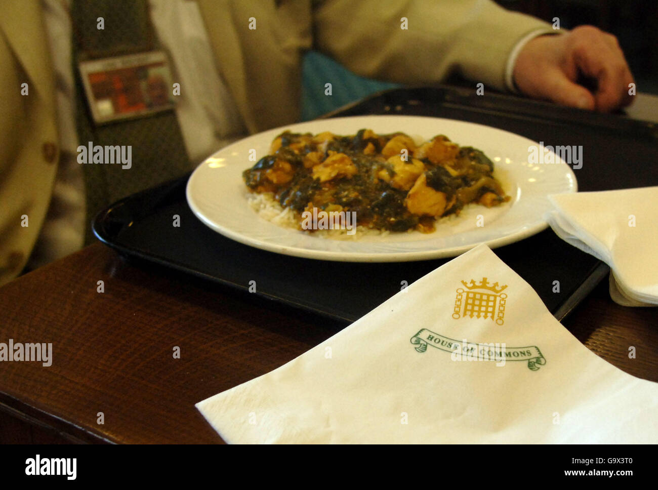 Press Association political correspondent Chris Moncrieff's lunch of 'Chicken Chat' is seen alongside a House of Commons napkin, in the Press cafe, in the Houses of Parliament in Westminster, London. Stock Photo