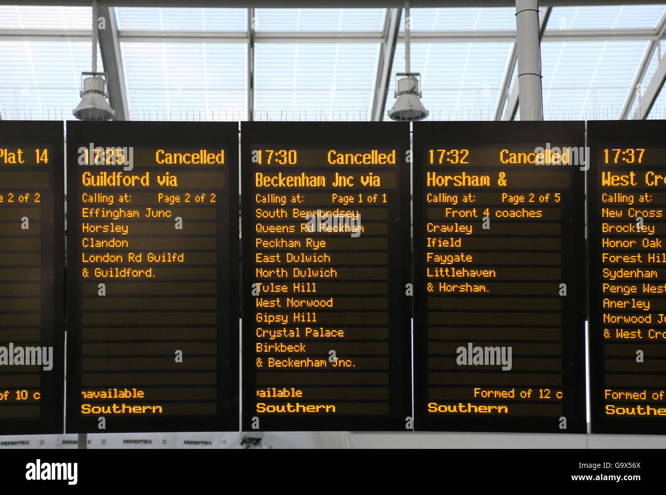 Southern train departure board at London Bridge station shows three cancelled rush-hour  trains on adjacent panels. London, UK. Stock Photo